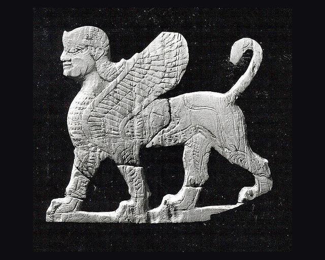 Plaque with a striding sphinx