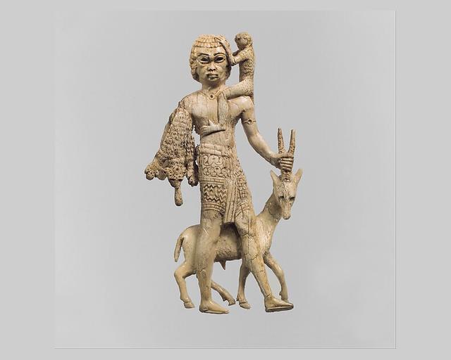 Figure of a man with an oryx, a monkey, and a leopard skin