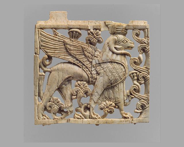 Openwork furniture plaque with a striding, ram-headed sphinx