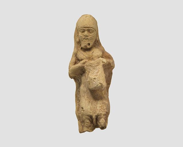 Figurine plaque: bearded man playing a drum