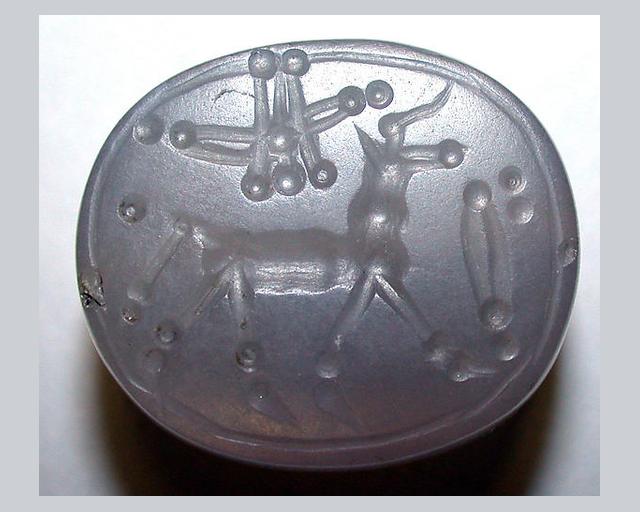 Stamp seal (scaraboid) with animal and divine symbols